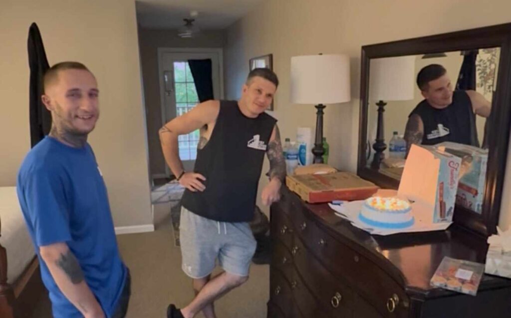 Professional movers eating pizza lunch during moving day Pittsburgh PA 1st Step Movers crew break time residential moving services customer appreciation feeding movers Greater Pittsburgh local moving company