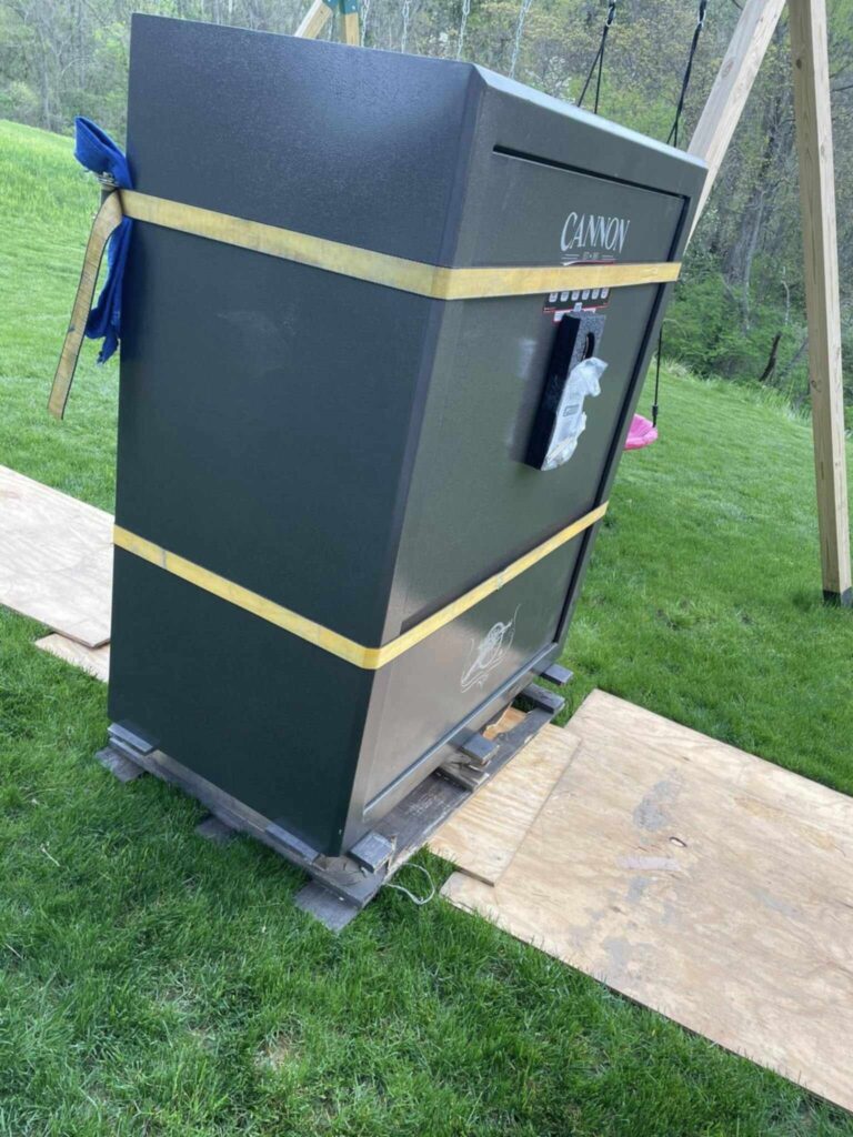 Professional movers transporting large Cannon gun safe in Pittsburgh PA - 1st Step Movers heavy safe moving services for firearms storage relocation with specialized equipment and expert handling"